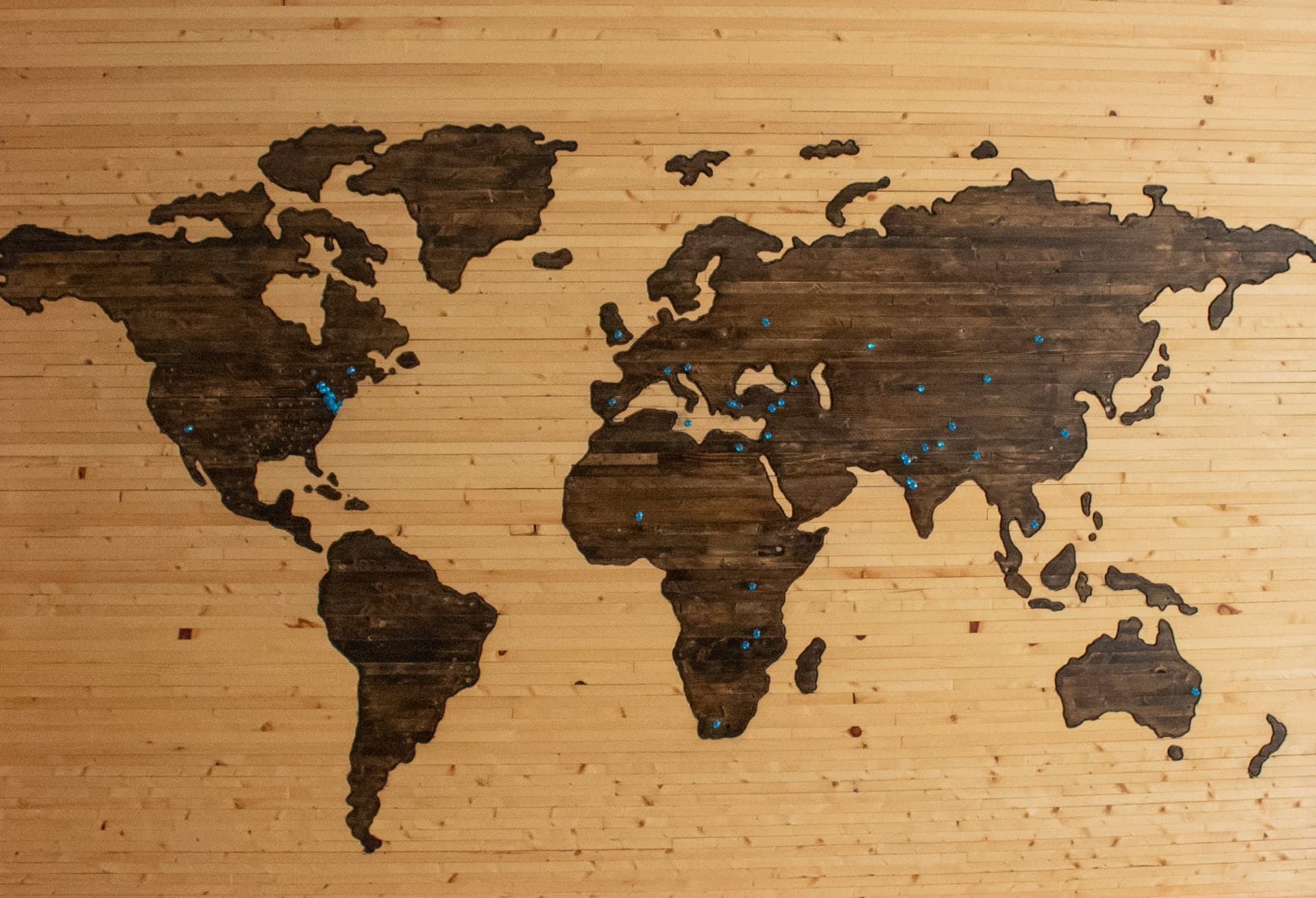 A clean, minimalist digital map showing world connections
